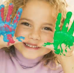 Girl with green paint on her hands