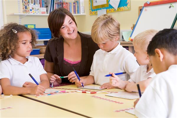 Teacher at a table with students